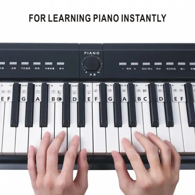 Black electronic piano with white and black keys featuring silicone strips piano keyboard note labels for beginners practice
