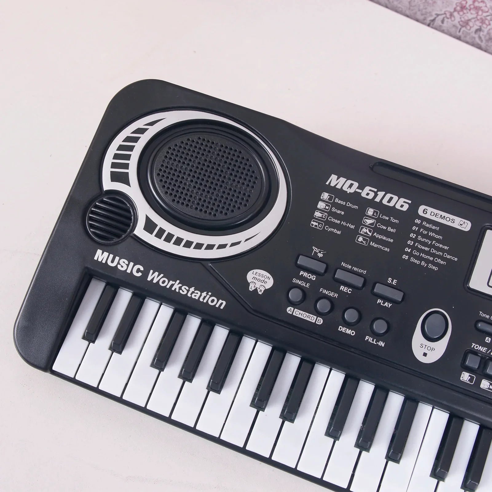 Black plastic 61 keys electric piano kids digital music keyboard with white and black keys and silver speaker grille gift musical instrument
