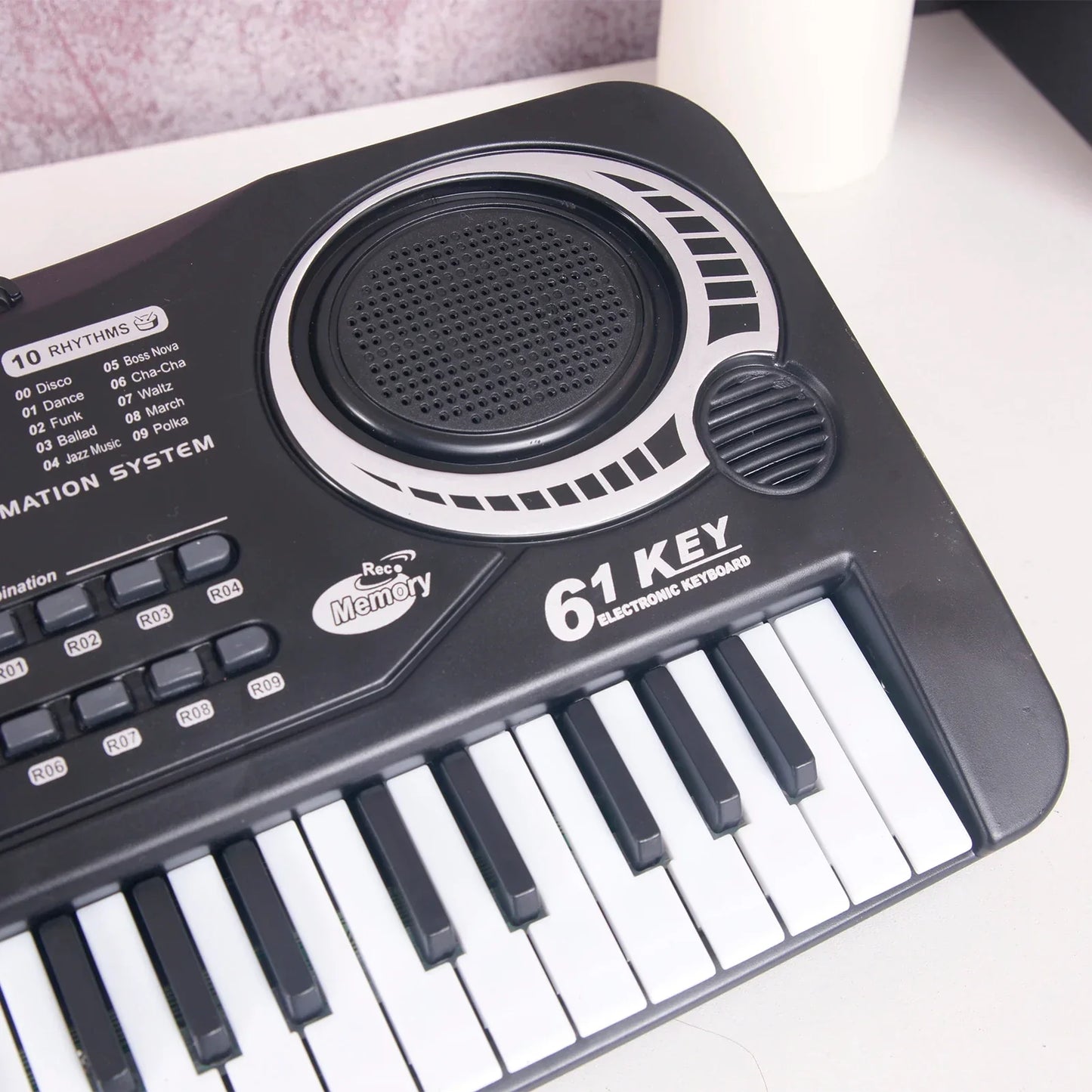 Black and white 61-key electric piano kids keyboard with built-in speaker and rave memory control panel, ideal piano kids gift