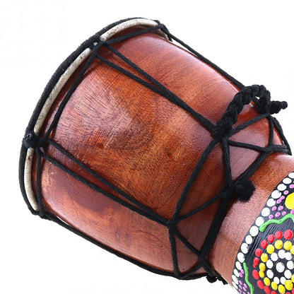 Handcrafted 6in african drum with solid wood body, goat skin head, black rope tension, and colorful dot patterns