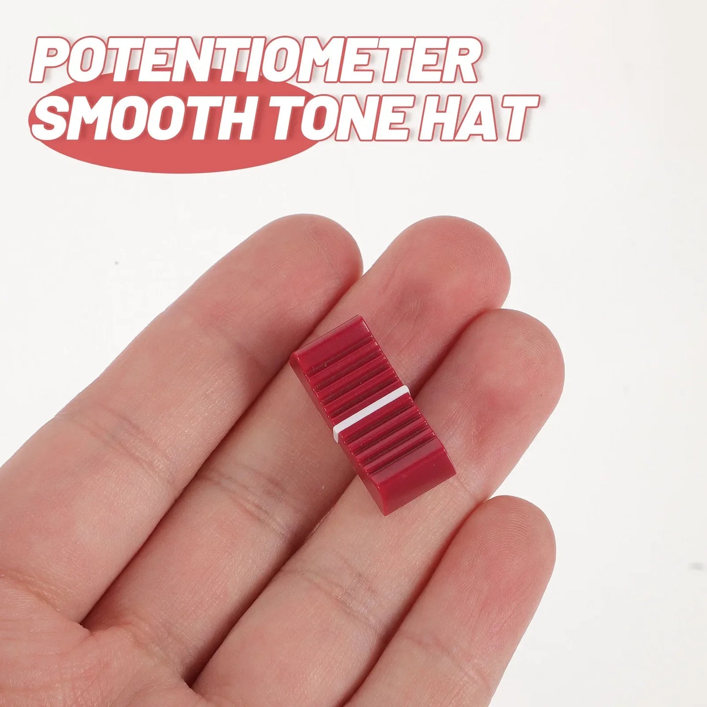 Red plastic slide potentiometer knob with smooth ribbed texture and white stripe for equipment guitar mixer volume brightness adjustment