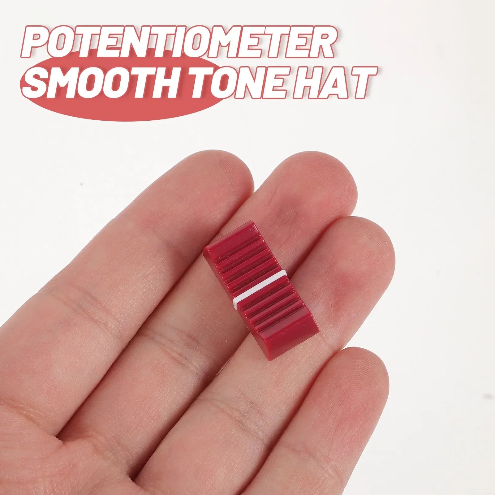 Red plastic slide potentiometer knob with smooth ribbed texture and white stripe for equipment guitar mixer volume brightness adjustment