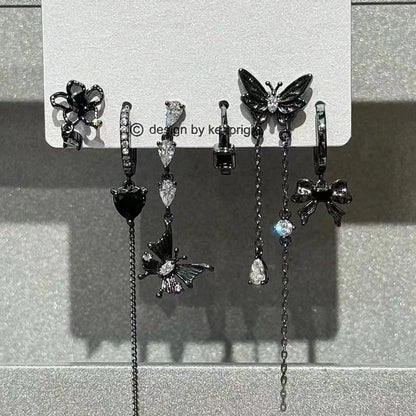 Black butterfly and flower-shaped earrings with crystal accents featuring sleek metallic finish from rock y2k jewelry set