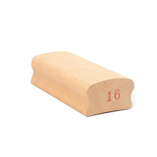 Light-colored wooden guitar radius sanding block with smooth curved surface and 16in stamp for parts arc polishing
