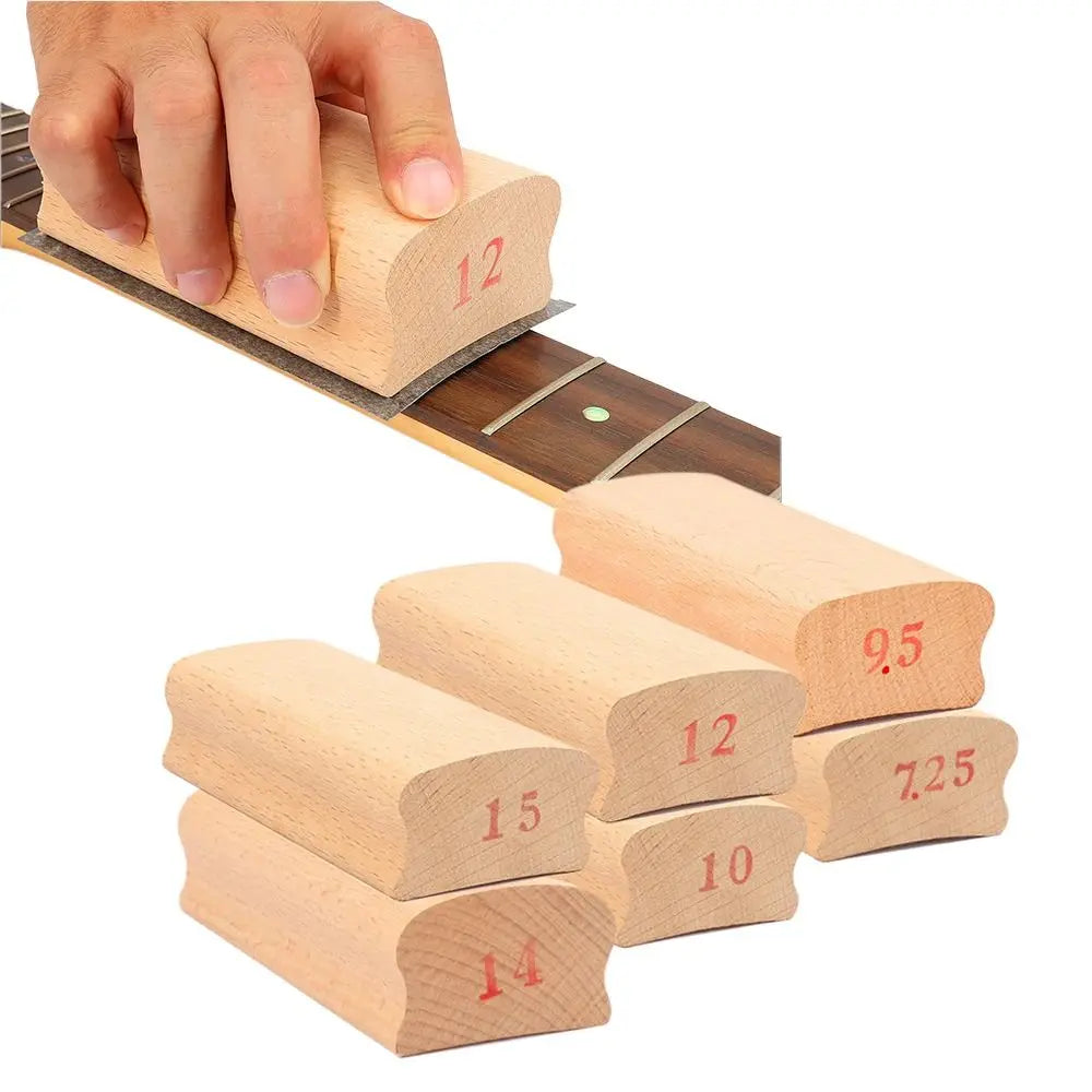 Light-colored wooden guitar radius sanding blocks with red numerical markings for parts arc polishing and fret leveling