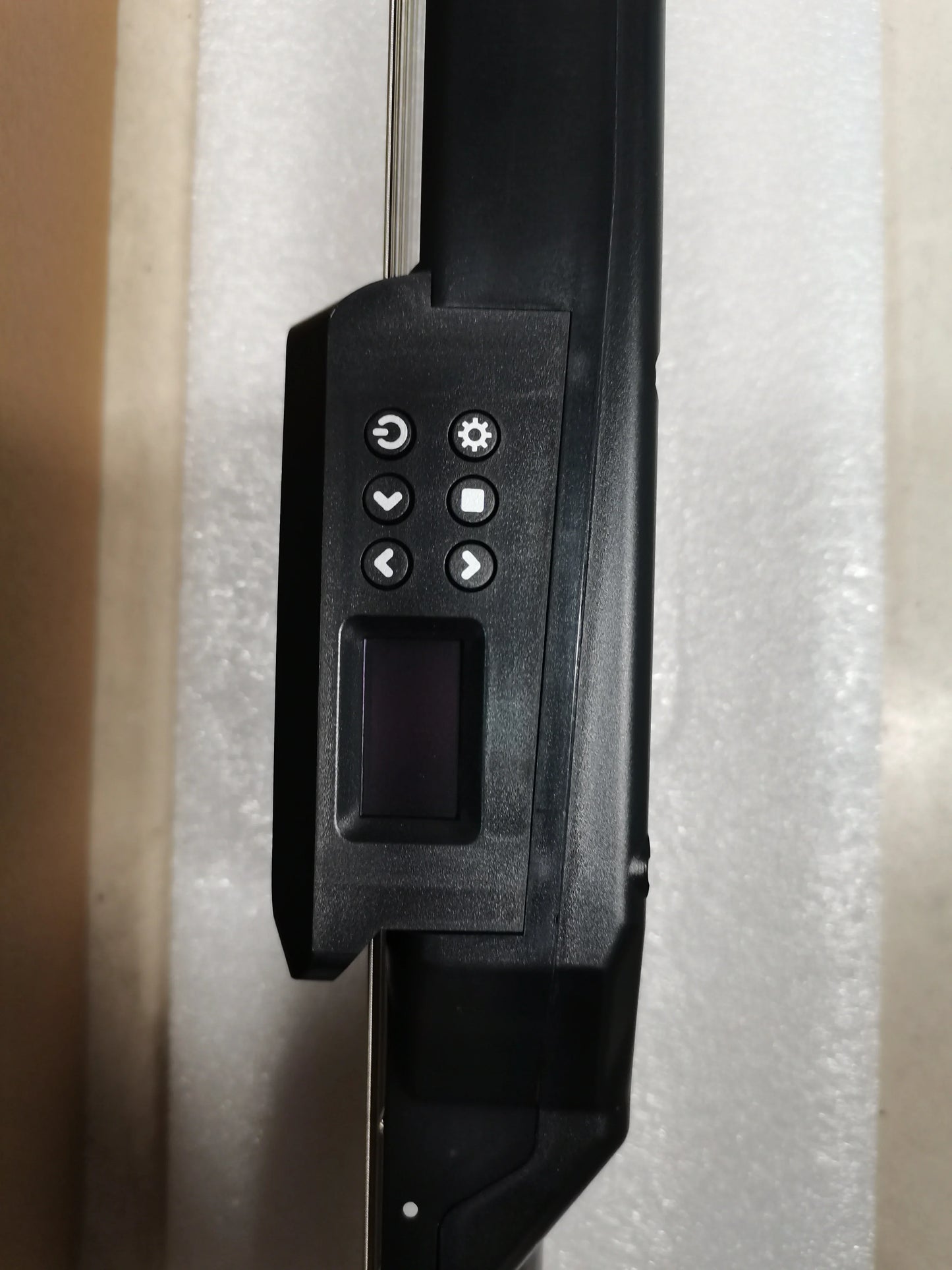 Black plastic control panel with six circular buttons and display screen on smart electric guitar silent digital tuner metronome