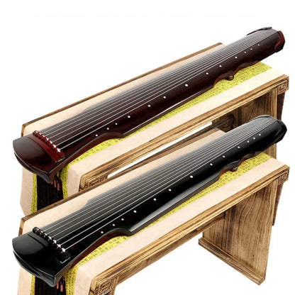 Two handmade guqin zithers in dark brown and glossy black with carved details for beginner stringed instruments with accessories chinese traditional
