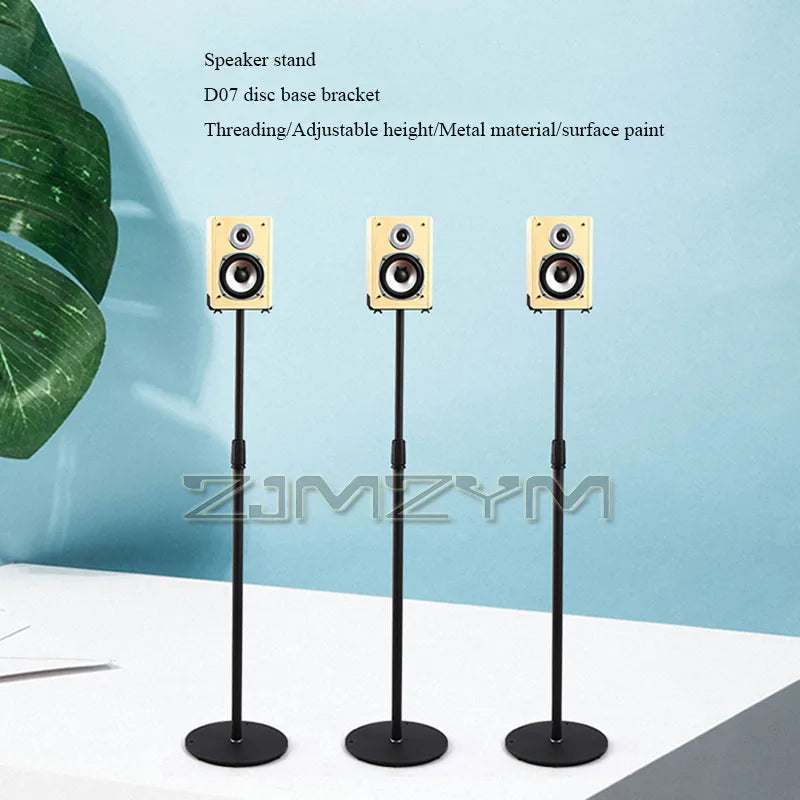 Three black metal adjustable speaker stands with cream rectangular speakers for surround frame home theater use