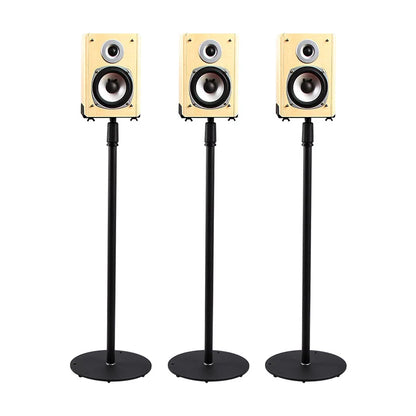 Three cream-colored wooden bookshelf speakers on black metal adjustable speaker stands for home theater use
