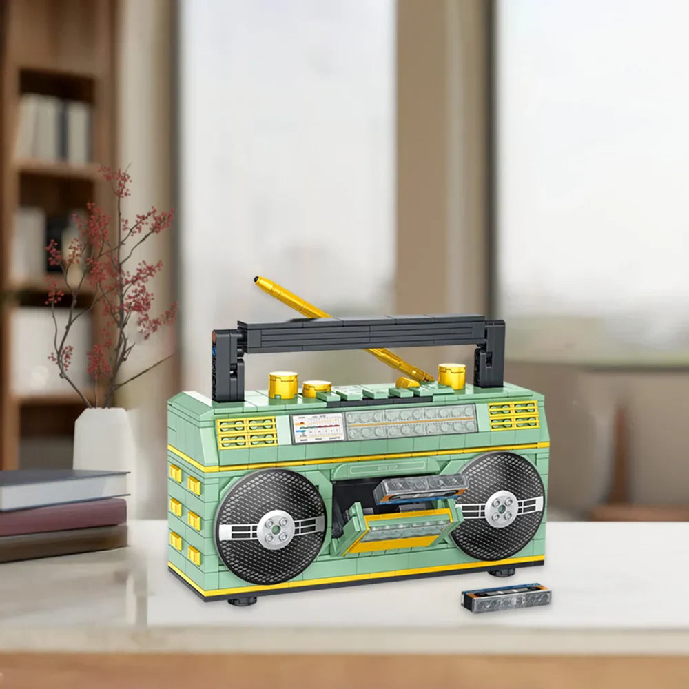 A mint green and yellow lego technic 781pcs retro radio with black speakers gold knobs and carrying handle vintage music player