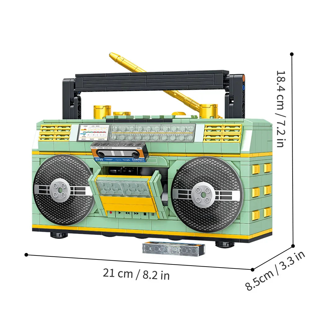 A mint green and yellow 781pcs retro radio vintage music player building blocks kit with black speakers and gold antenna