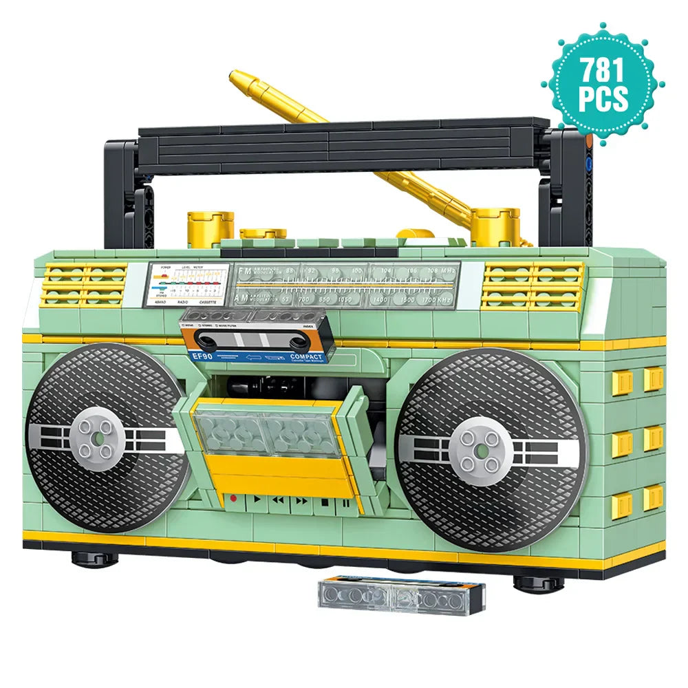 A mint green and yellow 781pcs retro radio lego-style vintage music player with black speakers gold antenna and cassette deck