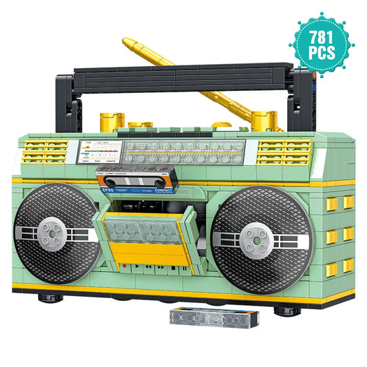 A mint green and yellow 781pcs retro radio lego-style vintage music player with black speakers gold antenna and cassette deck