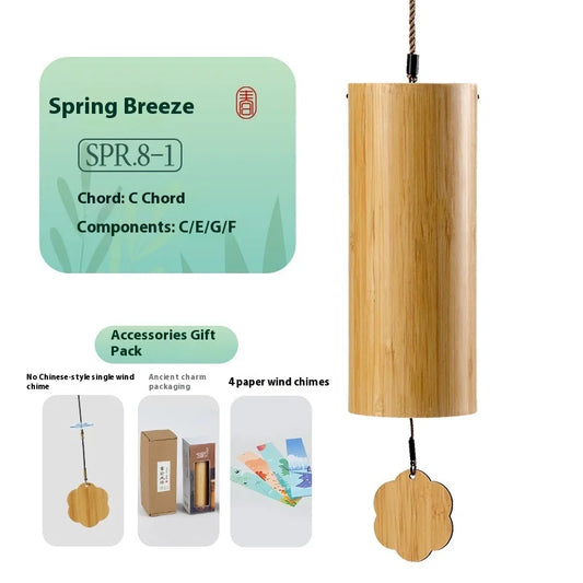 A light brown bamboo hand wind chime with a cylindrical body and flower pendant for chime balcony bedroom use