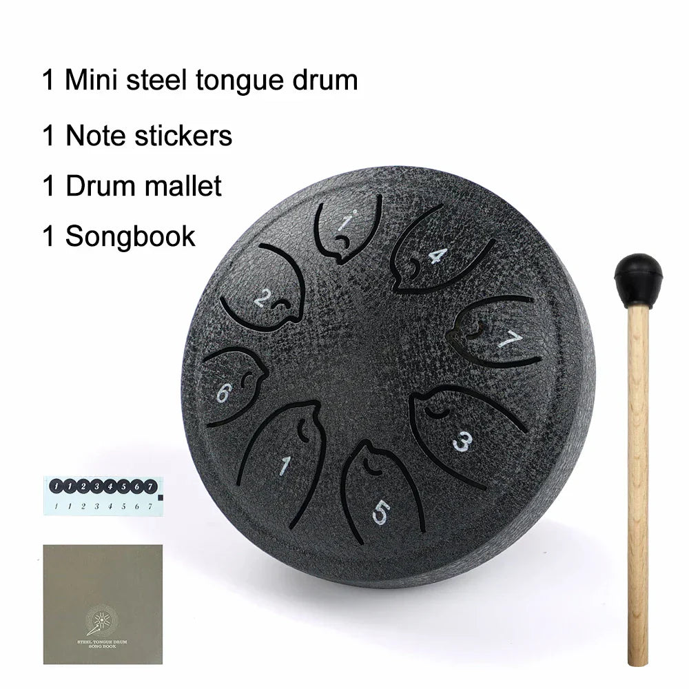 Dark gray steel tongue drum with seven numbered fish-shaped sound holes 8 notes ethereal drum musical toy instrument