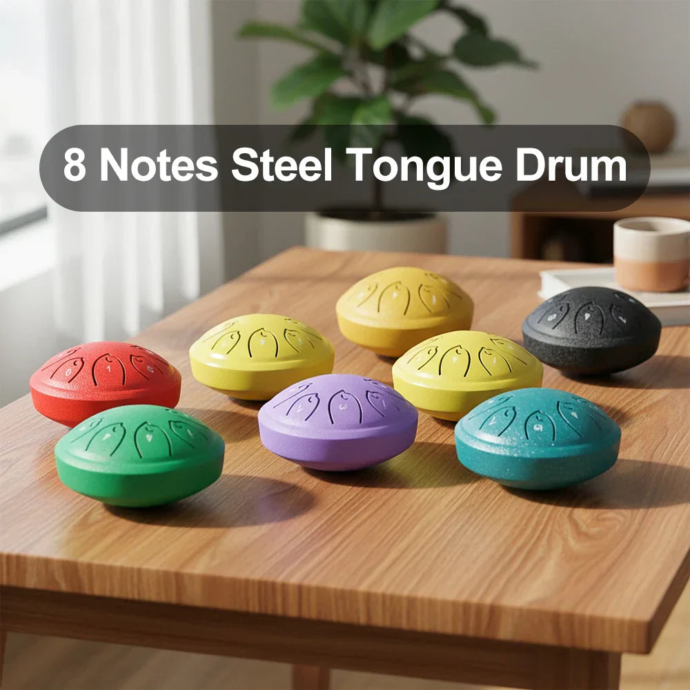 Set of colorful 8-note steel tongue drums with engraved fish patterns in red yellow purple green teal and black for musical toy instrument use