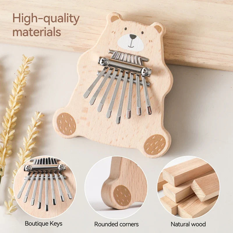 A charming light-colored wooden bear thumb piano kalimba with polished metal keys portable marimba musical baby montessori toy