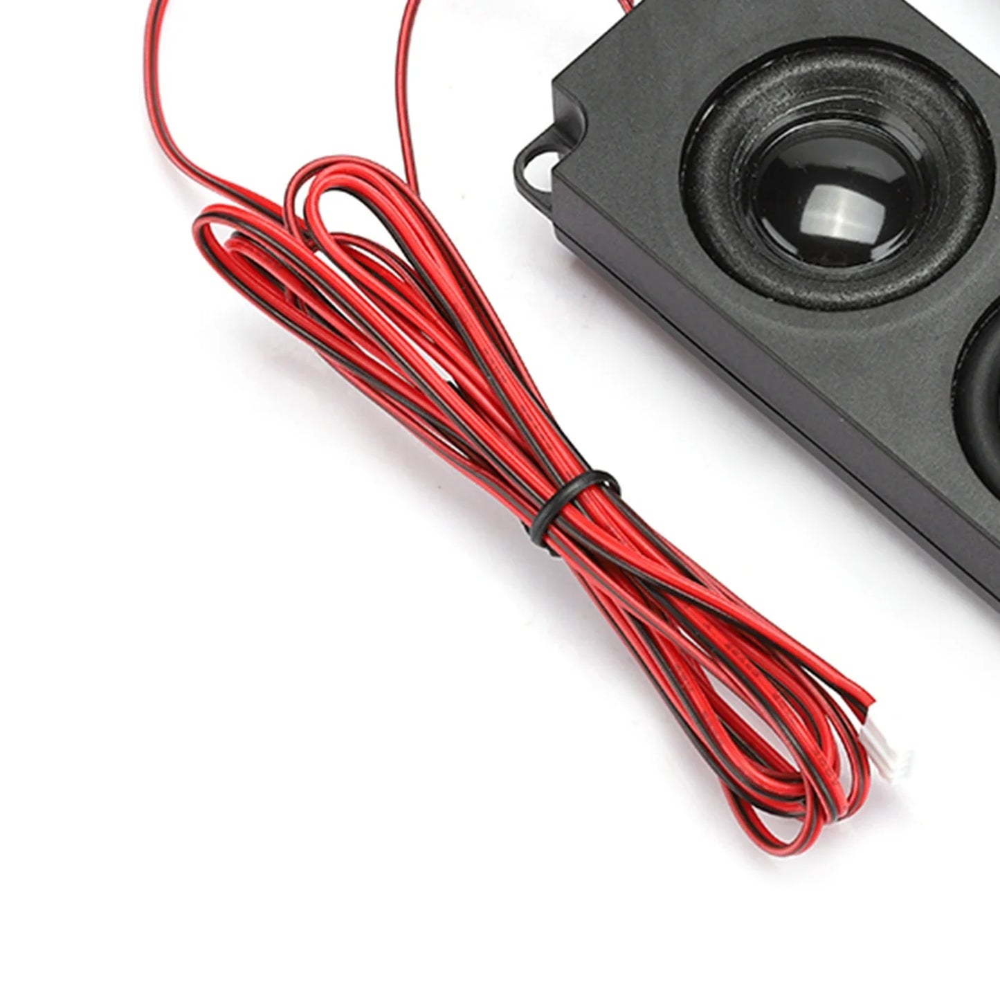 Black rectangular magnetic speaker with glossy cone and bundled red wiring designed for heavy bass audio use