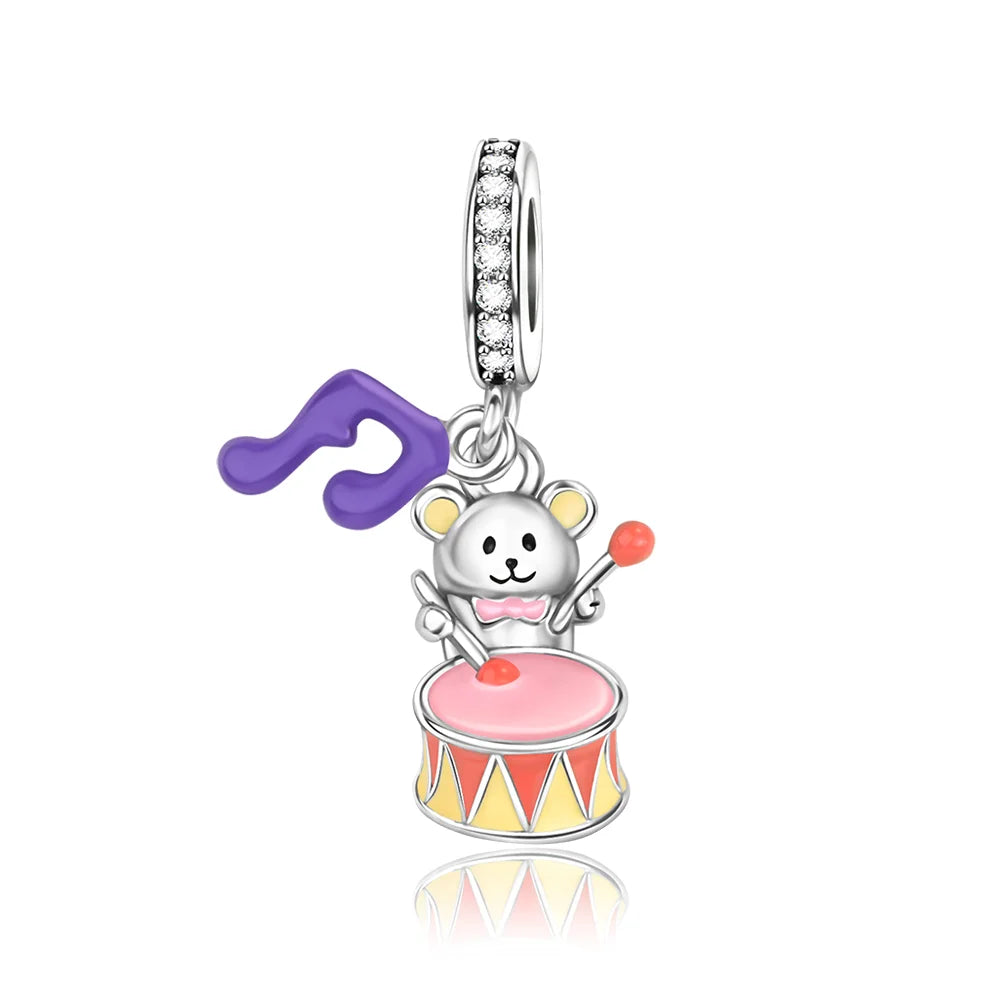Silver music charm featuring a sterling silver drum-playing bear with pink and red enamel for original bangle bracelet