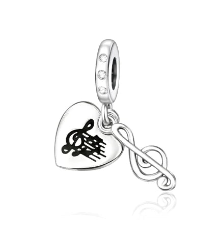 Silver sterling silver musical heart-shaped charm with engraved treble clef and dangling musical note for bracelet