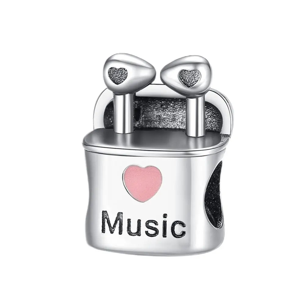 Silver sterling silver musical charm featuring miniature earbud case with pink and black heart accents for bracelet