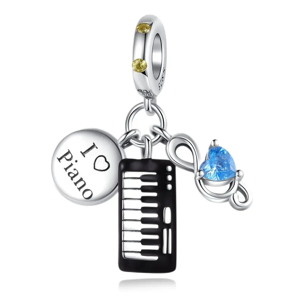 Silver sterling silver musical piano-themed charm with black keys blue heart gemstone and yellow stones for guitar earphone pendants