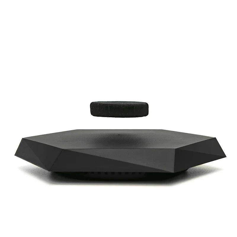 Black floating magnetic suspension display with sleek geometric base and rotating function for collectibles jewelry hand-made doll display