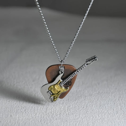 Silver and gold guitar-shaped pendant necklace with brown vintage guitar pick backing punk rock metal accessory