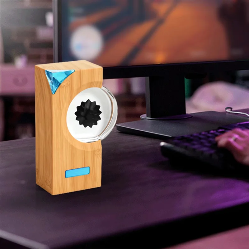 A sleek bamboo a15i ferrofluid music rhythm speaker with transparent circular front and blue accent magnetic liquid pickup details