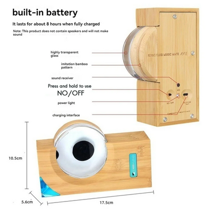 A sleek wooden music player with bamboo pattern and glass dome featuring eye design for ferrofluid music rhythm pickup equipment visual