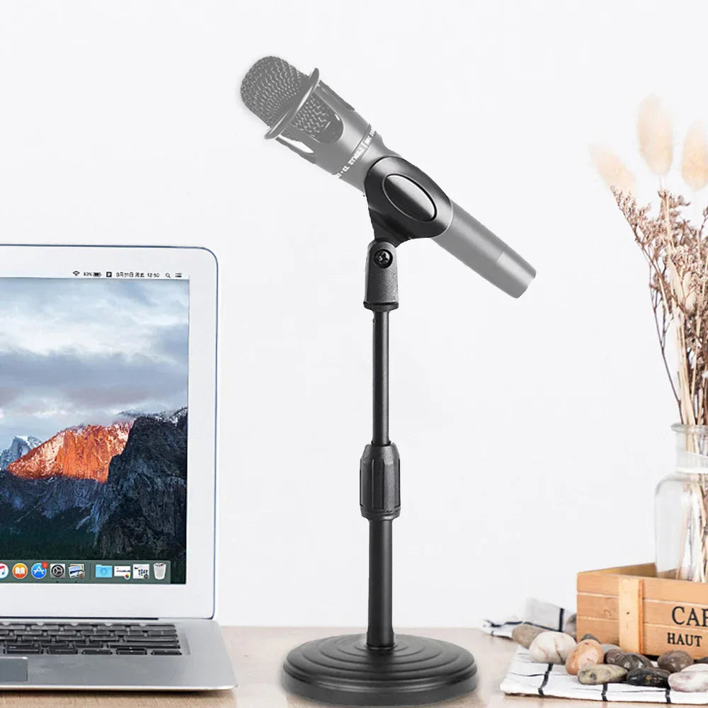 Black abs microphone stand with desktop retractable clamp and weighted disc base holding gray condenser microphone