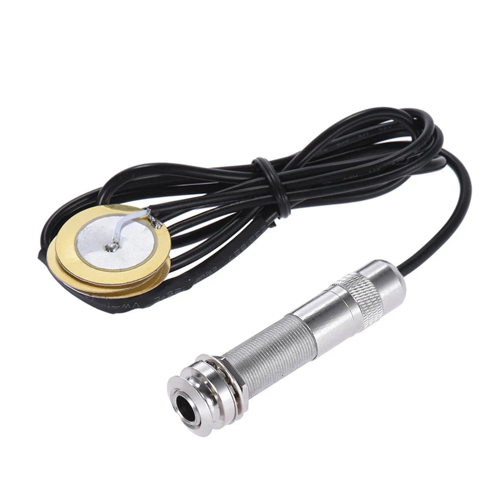 Silver guitar pickup with gold base and black cable for acoustic string instrument guitar mandolin ukulele type beat music