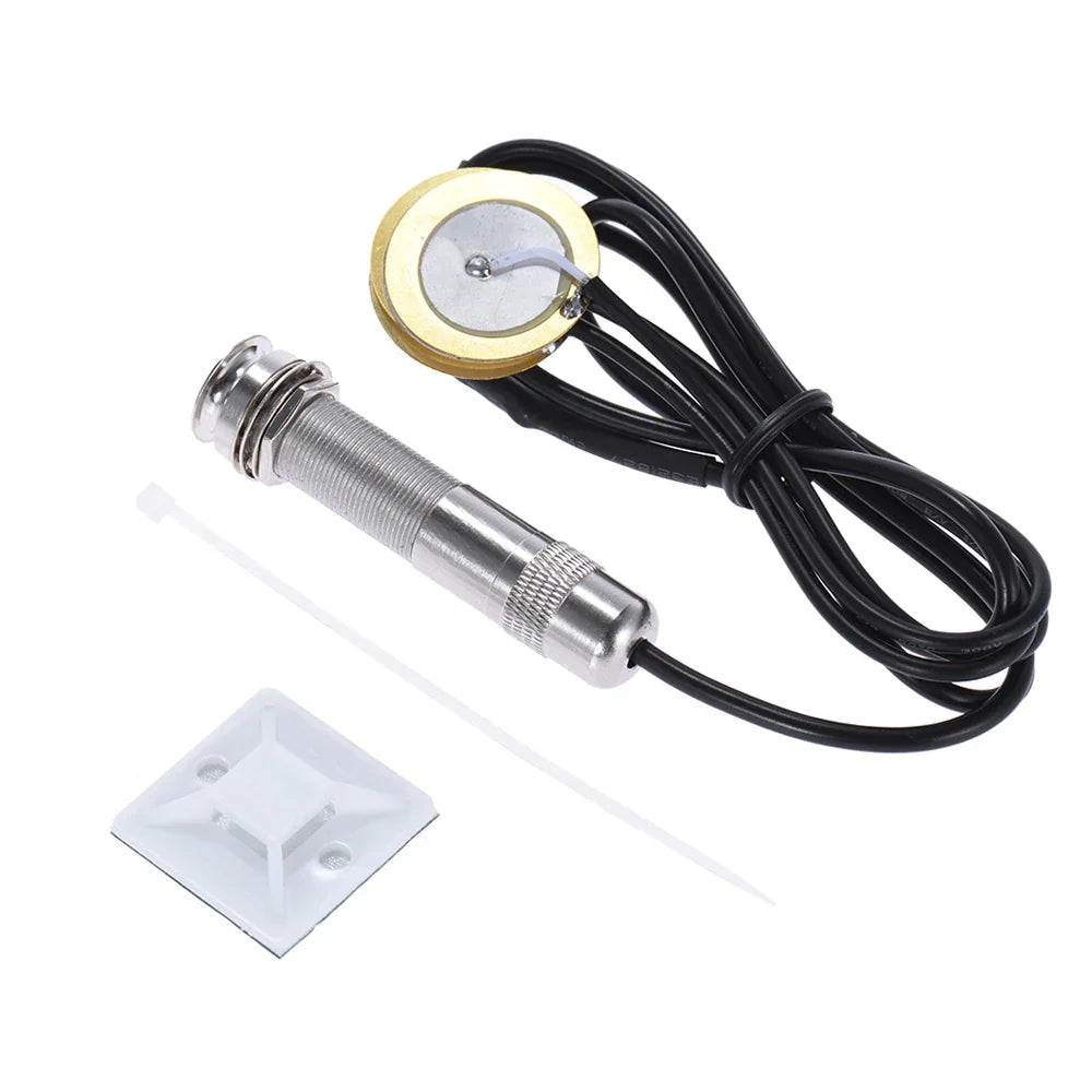 Silver-toned acoustic string instrument piezo pickup with gold magnet and black wiring for guitar mandolin ukulele type beat music