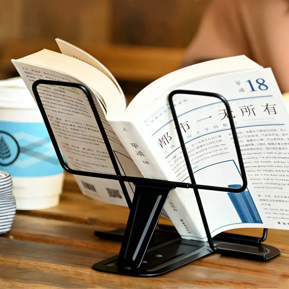 Black metal adjustable portable folding bookend stand holding an open book on a books recipe shelf organizer