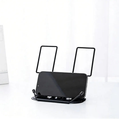 Black metal adjustable portable folding bookend stand with two upright supports and curved base holding smartphone