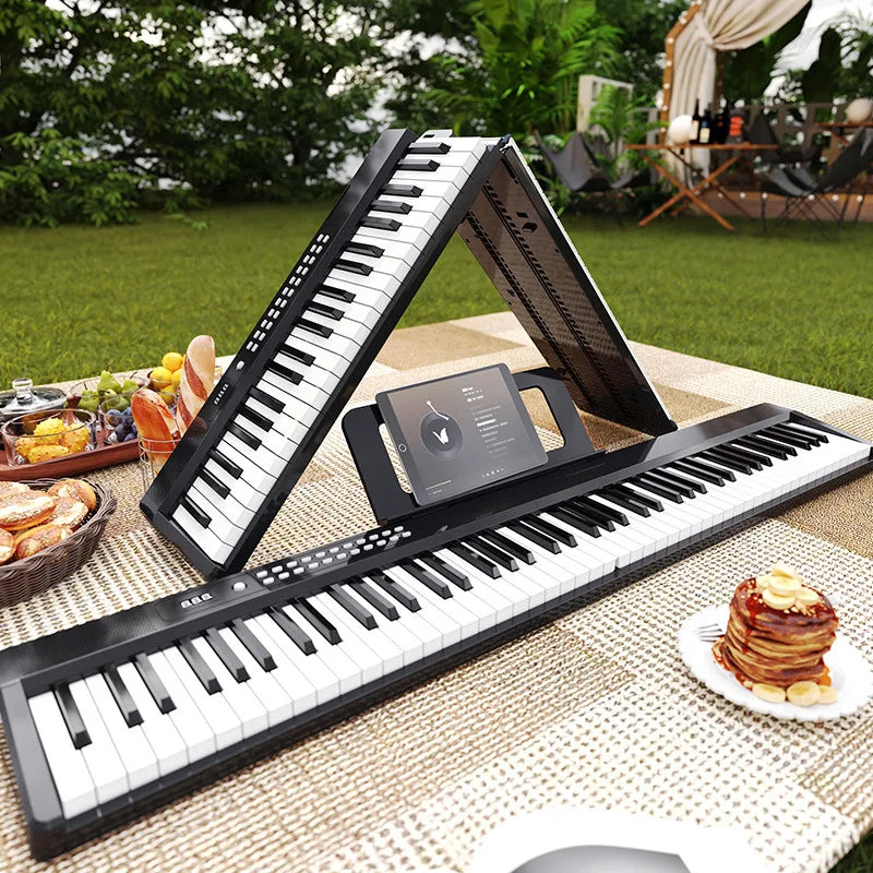 Black and white foldable adult electronic piano 88-key with built-in tablet stand and keyboard microphone interface