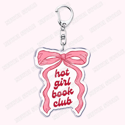Pink ribbon-themed acrylic keychain with hot girl book club text in red script for womens accessories ribbon gifts