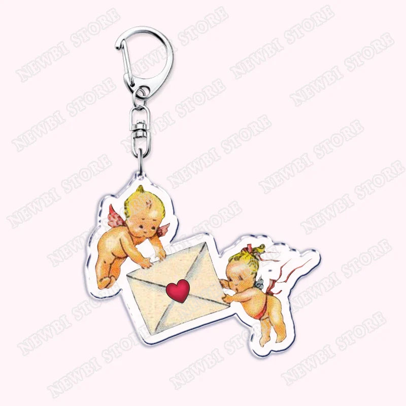 Clear acrylic aesthetic coquette pink keychain with cherubs holding heart envelope and attached to silver clasp for womens accessories ribbon hot girl book gifts