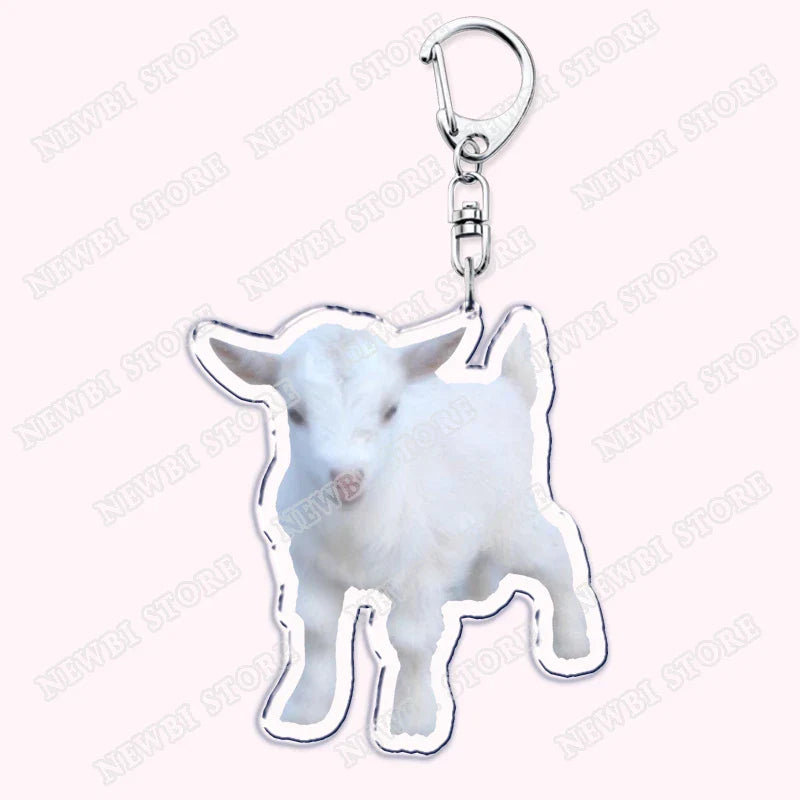 A white acrylic keychain with a baby goat cutout and silver edges for aesthetic coquette pink womens accessories ribbon gifts
