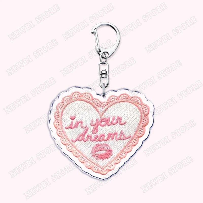 Pink embroidered heart shaped keychain with lace border and in your dreams text for aesthetic coquette pink womens accessories ribbon and hot girl book club gifts