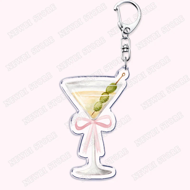 Clear acrylic martini glass keychain with pink ribbon bow and green olives for aesthetic coquette pink womens accessories ribbon