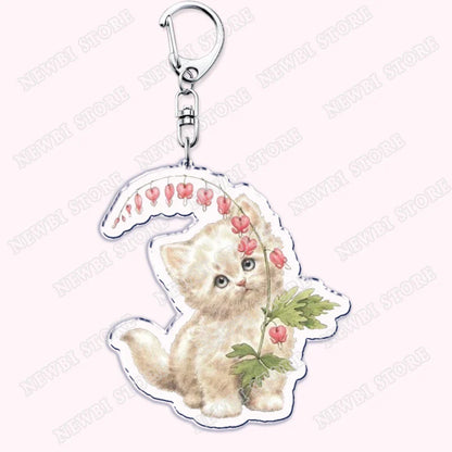 Aesthetic coquette pink clear acrylic keychain with cream kitten and pink flower vine for womens accessories ribbon gifts