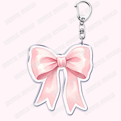 Pink acrylic bow keychain with silver metallic outline and clasp for aesthetic coquette pink womens accessories ribbon gifts