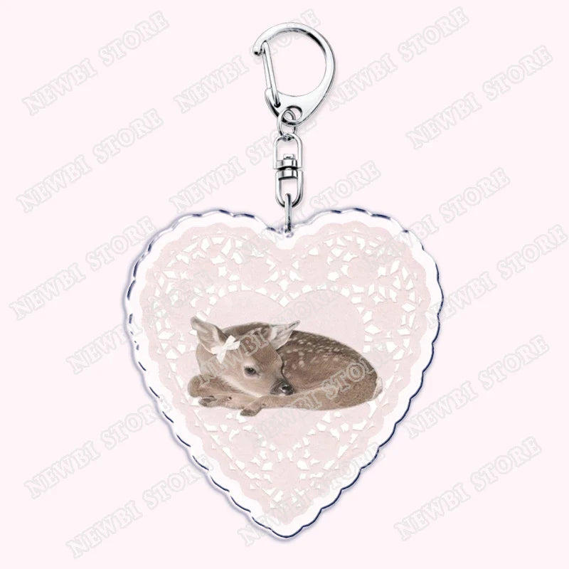 Heart-shaped aesthetic coquette pink keychain with silver clasp and lace border featuring sleeping fawn for womens accessories ribbon and hot girl book club gifts
