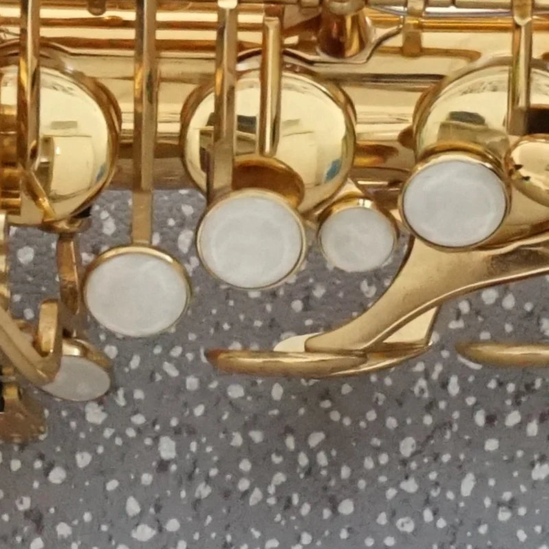 Golden saxophone keys with white pearl-like pads on aiersi brand gold lacquer eb alto saxophone music instrument custom logo