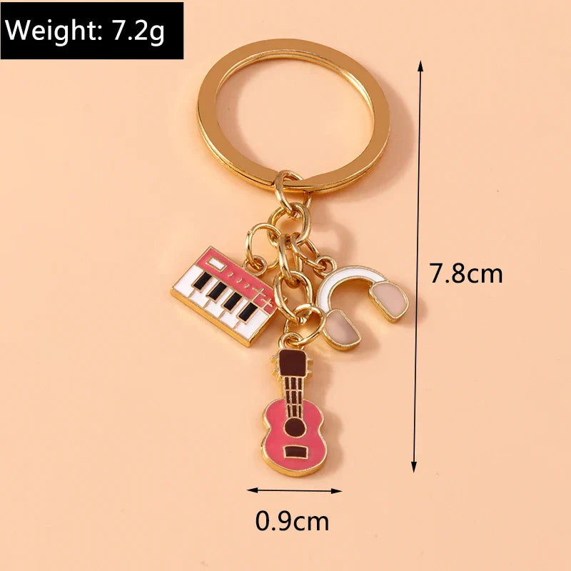 Gold-toned aihua enamel musical keychain with red keyboard white headphones and pink guitar charms for women girls diy