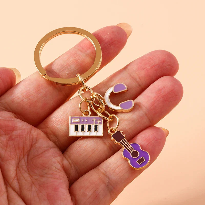 Aihua enamel musical gold-toned keychain with purple and white musical instrument keychains for women girls diy use