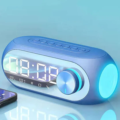 Blue alarm clock radio with digital clock display and illuminated buttons featuring speaker portable subwoofer design