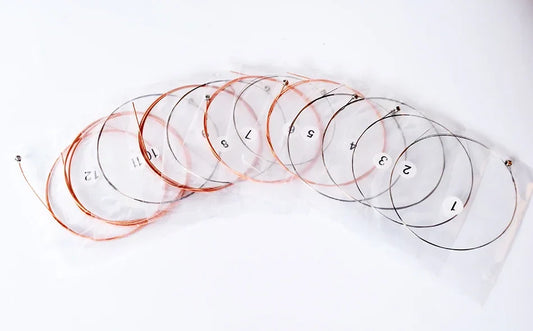 A set of ten clear plastic-wrapped alice a2012 coated copper alloy acoustic guitar strings for musical instrument guitar use