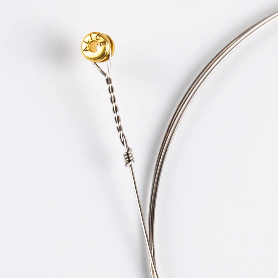 Gold-colored circular tuning peg with engraved lettering and twisted plated steel string for alice a2012 12 strings guitar